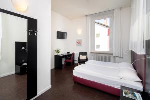 Ένα ή περισσότερα κρεβάτια σε δωμάτιο στο Hotel Rio Muralto