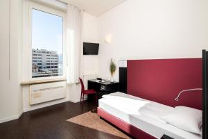 Ένα ή περισσότερα κρεβάτια σε δωμάτιο στο Hotel Rio Muralto
