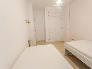 Posteľ alebo postele v izbe v ubytovaní REZAL Urb Águila Cálida y preciosa casa cerca de la playa