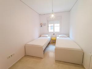 Posteľ alebo postele v izbe v ubytovaní REZAL Urb Águila Cálida y preciosa casa cerca de la playa