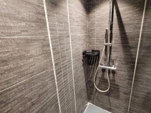 a bathroom with a shower with a toilet in it at Charmant T2 près pistes, Les Gets, balcon, parking, wifi - FR-1-598-135 in Les Gets