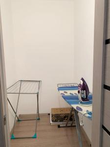 a room with a table with a helmet on it at Комфортабельные апартаменты по Туран in Taldykolʼ