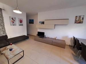 A television and/or entertainment centre at St Julians Sliema 3 minutes walk from promenade 3 bedroom apartment