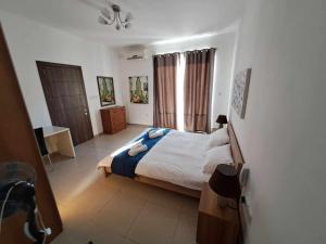 A bed or beds in a room at St Julians Sliema 3 minutes walk from promenade 3 bedroom apartment