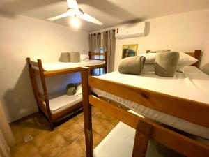 a room with two bunk beds and a ceiling at Family Hostel in Sao Paulo