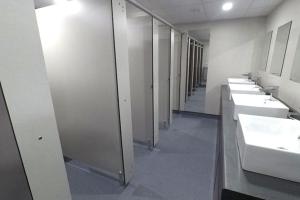 a bathroom with a row of sinks and mirrors at Campsie Glen Holiday Park in Glasgow
