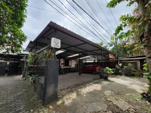 a building with a no smoking sign in front of it at SEMERU HOSTEL MALANG in Malang
