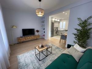 TV a/nebo společenská místnost v ubytování ByAndreea Apartaments EtxeBi