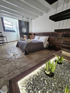 a bedroom with a bed in a room at Binario1 Rooms in Barletta