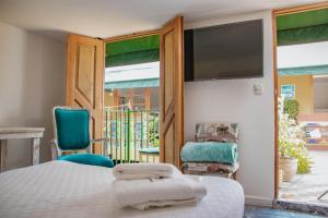 TV a/nebo společenská místnost v ubytování Hotel La Casona de Getsemani