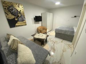 a living room with a couch and a bed at King's Landing Esma' house in Dubrovnik