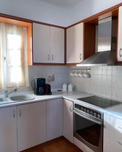 Kjøkken eller kjøkkenkrok på Nereid Skyros House