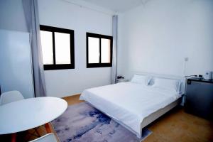 Ένα ή περισσότερα κρεβάτια σε δωμάτιο στο Your Silicon Oasis Comfort Haven +7 φωτογραφίες