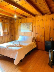 Posteľ alebo postele v izbe v ubytovaní Chalé Bolzano Monte Verde MG