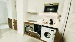 A kitchen or kitchenette at Luxury Bahia Sea Views By Deihu Experiences