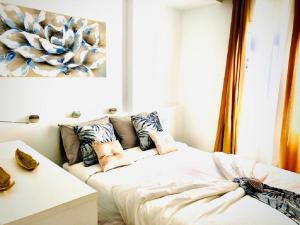 A bed or beds in a room at Luxury Bahia Sea Views By Deihu Experiences