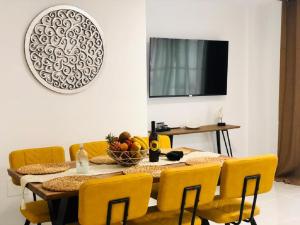 A television and/or entertainment centre at Luxury Bahia Sea Views By Deihu Experiences