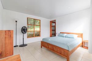 Postel nebo postele na pokoji v ubytování Finca Mango - 40 acre paradise