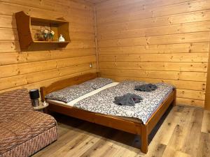 Postel nebo postele na pokoji v ubytování Penzion na Lůkách