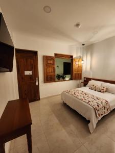 Postel nebo postele na pokoji v ubytování Casa Isabel Hotel + 37 fotografií