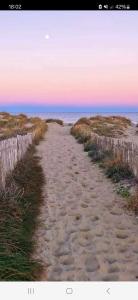 a dirt road leading to the ocean on a beach at MOBILHOME SOLEIA NEUF 2023 MAR ESTANG SIBLU VILLAGE Canet-en-Roussillon in Canet-en-Roussillon