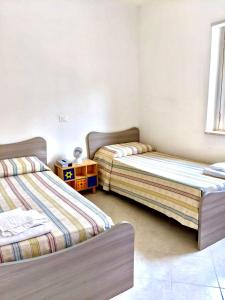 Ένα ή περισσότερα κρεβάτια σε δωμάτιο στο Apartment Difesa Pizzo