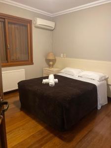 En eller flere senge i et værelse på Apartamento Quinta da Serra - Canela