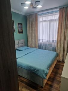Een bed of bedden in een kamer bij Apartament Hotel, Chisinau, Botanica, Aeroport