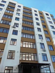 a tall building with many windows on it at Apartament Hotel, Chisinau, Botanica, Aeroport in Chişinău