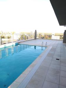 a swimming pool on the roof of a building at Dpto Alberdi in Santa Fe