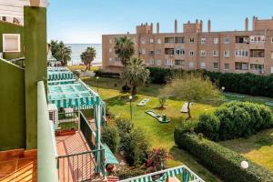 a view from a balcony of a building with a park at Beach Duplex with Sea views in Málaga