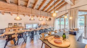 a large dining room with tables and chairs at Résidence Casa San Bernardo - Chalets pour 18 Personnes 851 in Tignes