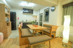 a kitchen and dining room with a table and chairs at Fushimi Yokkusu Building 10F - Vacation STAY 16301 in Nagoya