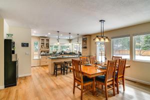 a kitchen and dining room with a table and chairs at Serene Nevada Retreat with Deck, Grill and Hot Tub! in Stateline
