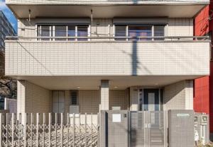 a building with a fence in front of it at Residential Voyan Minamisunacho - Vacation STAY 14988v in Tokyo