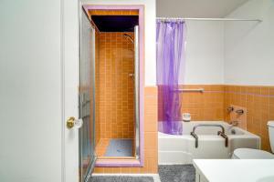 a bathroom with a tub and a toilet and a shower at San Francisco Home about 1 Mi to Golden Gate Park! in San Francisco