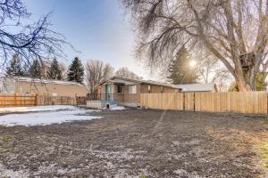 a house with a wooden fence and a yard at Cozy and Pet-Friendly Rexburg Home with Fenced Yard! in Rexburg