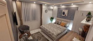 Voodi või voodid majutusasutuse GOLD APARTMANI toas