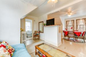 a living room with a couch and a table at Cozy Niagara Falls Cottage with Gas Grill and Patio! in Niagara Falls
