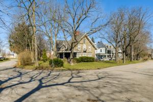 a house on the side of a street at Cozy Niagara Falls Cottage with Gas Grill and Patio! in Niagara Falls