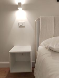 Postel nebo postele na pokoji v ubytování Ciliegia di Lari - Attico