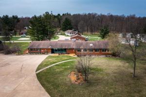 an aerial view of a house with a yard at 6 Guests 3br, Fully Furnished, On-site Enjoyment in Neillsville