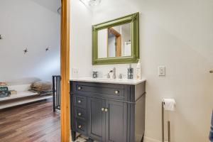 a bathroom with a sink and a mirror at Saint Paul Vacation Rental Near Shopping and Dining! in Saint Paul +25 photos