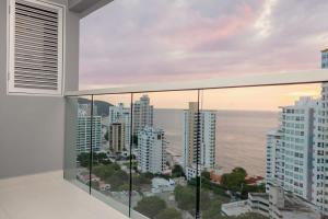 a balcony with a view of the ocean at Exclusive Luxury Jr Suite 1BRD By ENCOR in Gaira