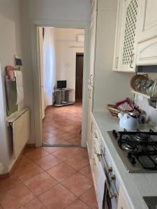 a kitchen with a stove and a counter top at Dimora Ghirlandaio in Florence