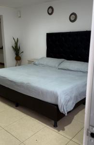 Кровать или кровати в номере Glamping termales La Calera