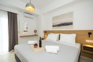 a bedroom with two beds with white pillows at Kiss-ammos Apartments in Kissamos