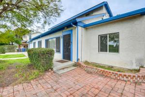 a blue and white house with a brick driveway at Spacious El Cajon Home - Day Trip to San Diego! in El Cajon