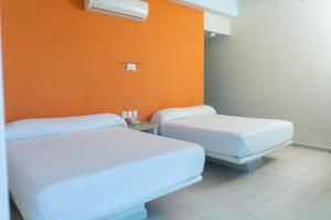 Ένα ή περισσότερα κρεβάτια σε δωμάτιο στο Fabuloso Hotel Las Vegas