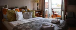 Posteľ alebo postele v izbe v ubytovaní Dia Apartman